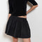 The Fousta Cotton Skirt by Suzie Kondi has an elastic pull-on waist, side pockets, and lightweight fabric