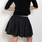 The Fousta Cotton Skirt by Suzie Kondi has an elastic pull-on waist, side pockets, and lightweight fabric