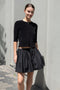 The Fousta Cotton Skirt by Suzie Kondi has an elastic pull-on waist, side pockets, and lightweight fabric