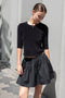 The Fousta Cotton Skirt by Suzie Kondi has an elastic pull-on waist, side pockets, and lightweight fabric