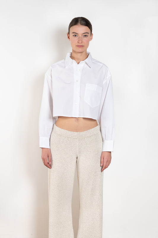 The  Leuka Cropped Shirt by Suzie Kondi has a cropped boxy fit, cuffed wrists for a crisp look.