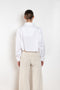 The  Leuka Cropped Shirt by Suzie Kondi has a cropped boxy fit, cuffed wrists for a crisp look.