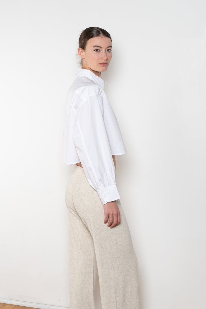 The  Leuka Cropped Shirt by Suzie Kondi has a cropped boxy fit, cuffed wrists for a crisp look.