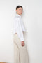 The  Leuka Cropped Shirt by Suzie Kondi has a cropped boxy fit, cuffed wrists for a crisp look.