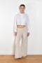 The  Leuka Cropped Shirt by Suzie Kondi has a cropped boxy fit, cuffed wrists for a crisp look.
