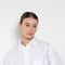 The  Leuka Cropped Shirt by Suzie Kondi has a cropped boxy fit, cuffed wrists for a crisp look.