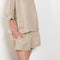 The Shkip Shorts Linen by Suzie Kondi is an A-line shorts with an elastic waistband and roomy pockets. An easy, pull-on style.