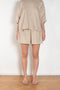 The Shkip Shorts Linen by Suzie Kondi is an A-line shorts with an elastic waistband and roomy pockets. An easy, pull-on style.