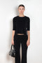The Corfu Elbow Sleeve by Suzie Kondi is a terry top with a fitted silhouette and a elbow length sleeve