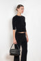 The Corfu Elbow Sleeve by Suzie Kondi is a terry top with a fitted silhouette and a elbow length sleeve