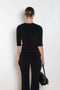 The Corfu Elbow Sleeve by Suzie Kondi is a terry top with a fitted silhouette and a elbow length sleeve