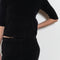The Corfu Elbow Sleeve by Suzie Kondi is a terry top with a fitted silhouette and a elbow length sleeve
