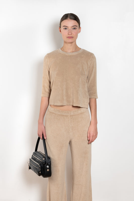 The  Corfu Elbow Sleeve by Suzie Kondi is a terry top with a fitted silhouette and a elbow length sleeve