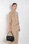 The Corfu Elbow Sleeve by Suzie Kondi is a terry top with a fitted silhouette and a elbow length sleeve