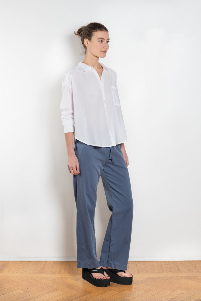 The Jordy Shirt by Xirena is&nbsp;an easy button-front shirt with a boxy fit, left chest pocket, and high low shirttail hem