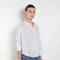 The Jordy Shirt by Xirena is&nbsp;an easy button-front shirt with a boxy fit, left chest pocket, and high low shirttail hem