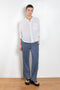 The Jordy Shirt by Xirena is easy button-front shirt with a boxy fit, left chest pocket, and high low shirttail hem