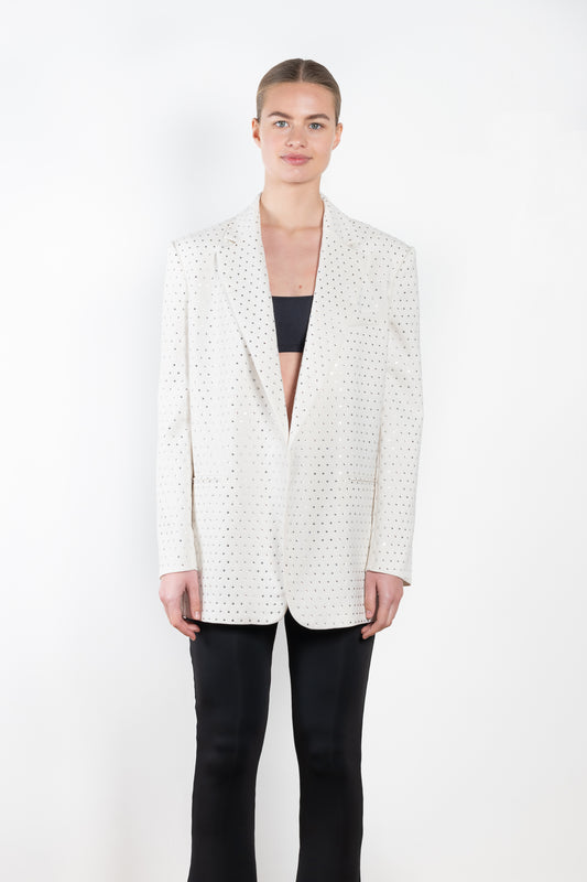 The Guia Blazer by The Andamane is a relaxed oversized blazer with all-over crystals in a bright white