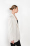 The Guia Blazer by The Andamane is a relaxed oversized blazer with all-over crystals in a bright white