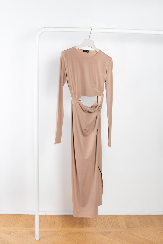 The Gia Dress by The Andamane is a midi dress with a cut-out detail and side slit