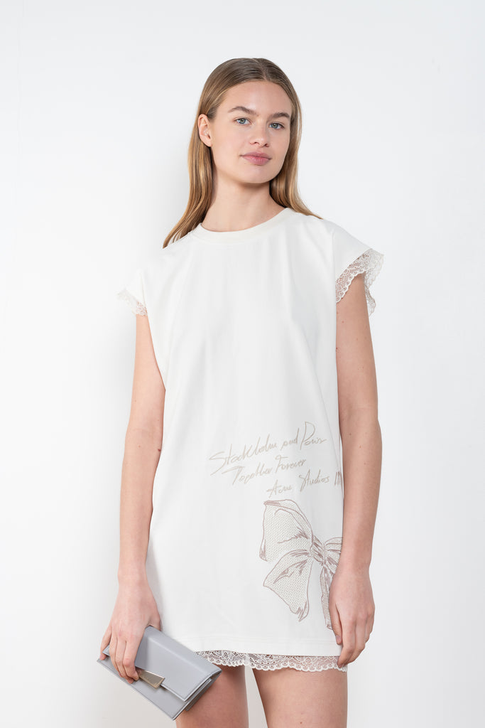 The Embroidered Dress 885 by Acne Studios is a short sleeved dress with a branded embroidery in this season's wedding theme, with contrast lace trims 