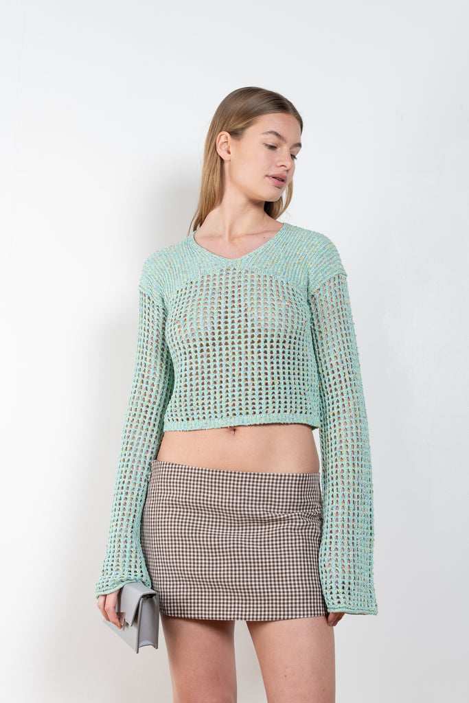 The Knitted Jumper 546 by ACNE STUDIOS is a aqua blue jumper in a knitted tonal yarn with a crochet knit finish and a semi-sheer appearance