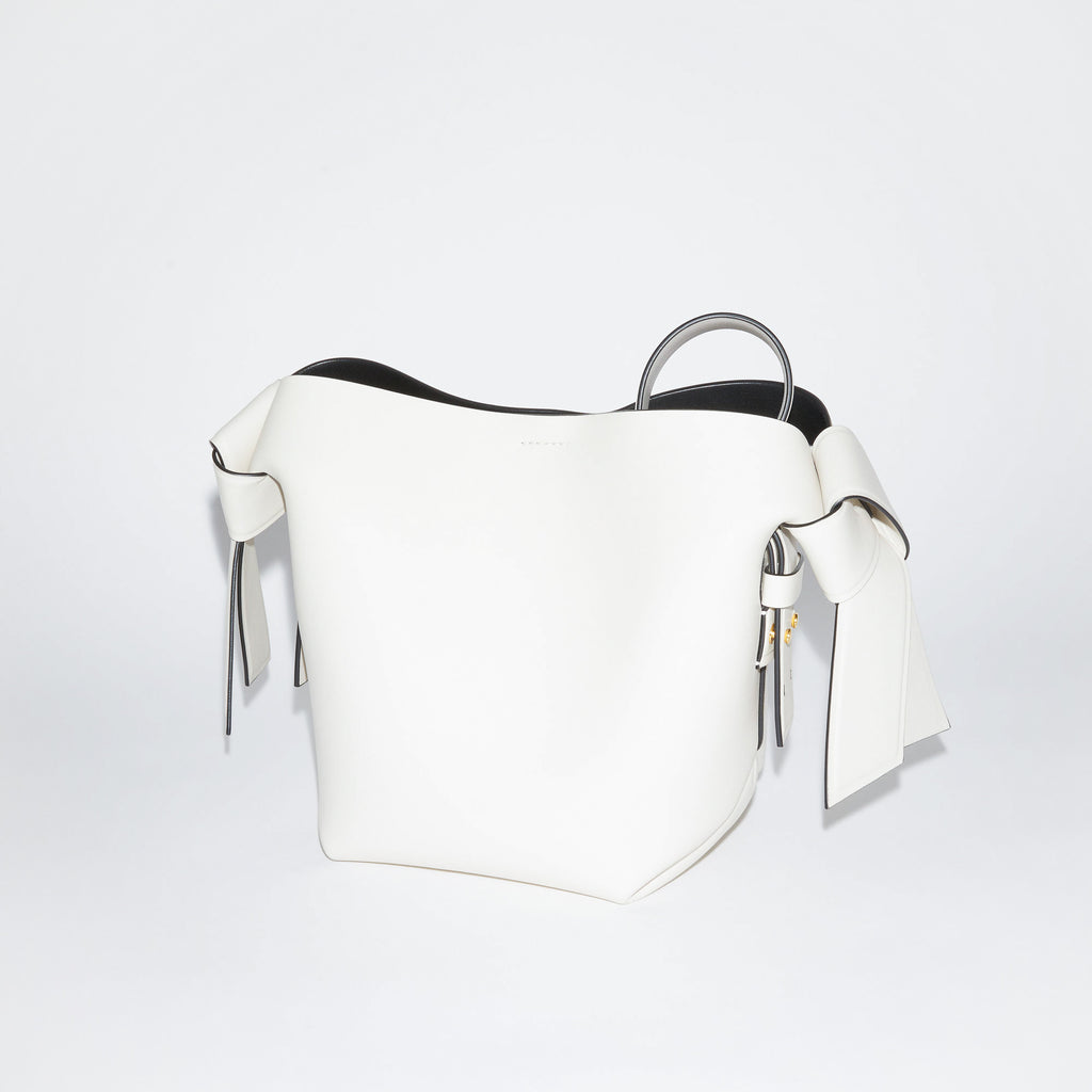 The Musubi Mini Bag by Acne Studios is a signature bag with twisted knots in a luxurious matte grain leather