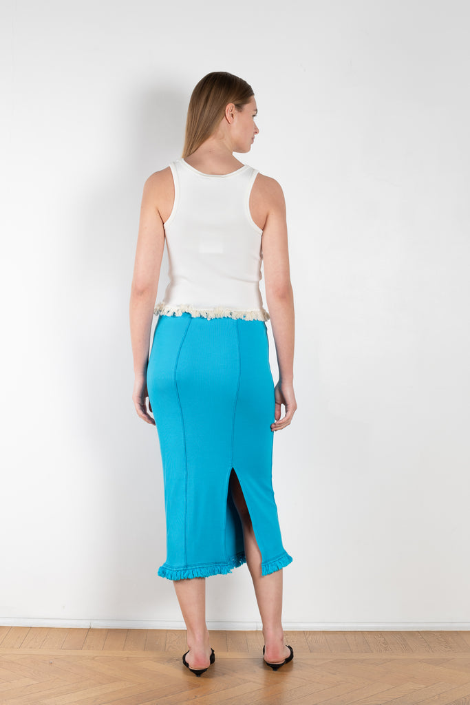 The Tassel Skirt 497 by Acne Studios is a turquoise pencil skirt with a ribbed finish, a tonal tassel at the bottom hem, stitching details and a back centre slit