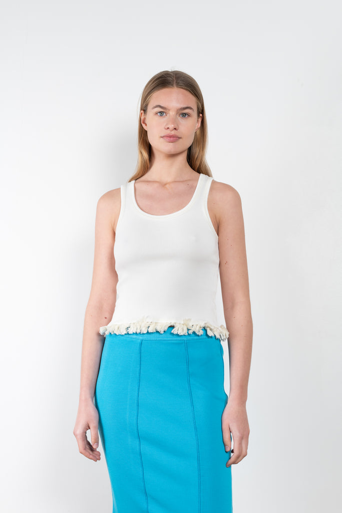 The Tassel Skirt 497 by Acne Studios is a turquoise pencil skirt with a ribbed finish, a tonal tassel at the bottom hem, stitching details and a back centre slit