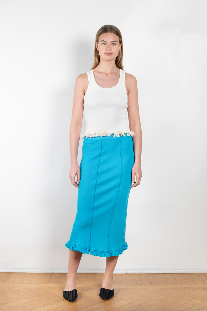 The Tassel Skirt 497 by Acne Studios is a turquoise pencil skirt with a ribbed finish, a tonal tassel at the bottom hem, stitching details and a back centre slit