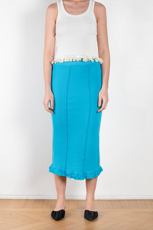 The Tassel Skirt 497 by Acne Studios is a turquoise pencil skirt with a ribbed finish, a tonal tassel at the bottom hem, stitching details and a back centre slit