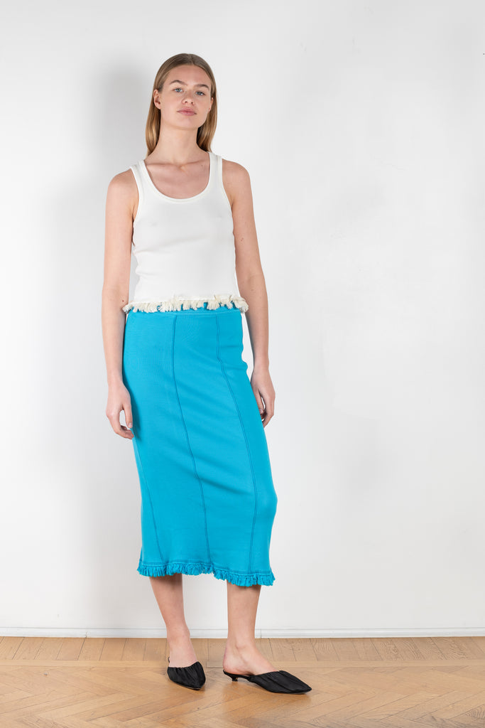 The Tassel Skirt 497 by Acne Studios is a turquoise pencil skirt with a ribbed finish, a tonal tassel at the bottom hem, stitching details and a back centre slit