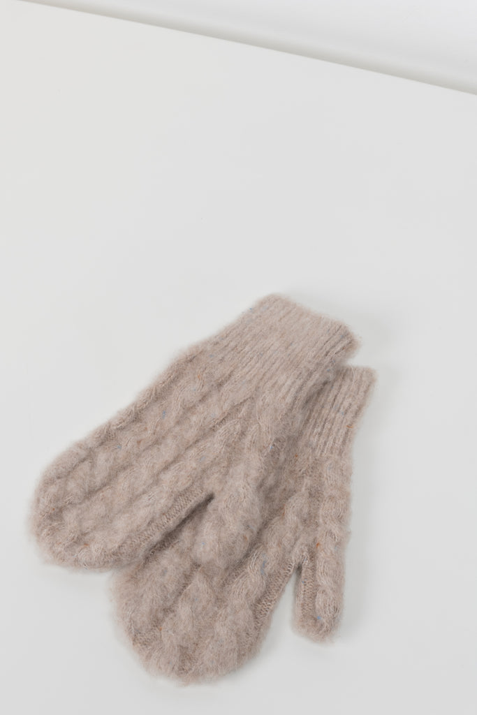 The Cable Knit Mittens 29  by Acne Studios are soft wool cable mittens with a ribbed cuff