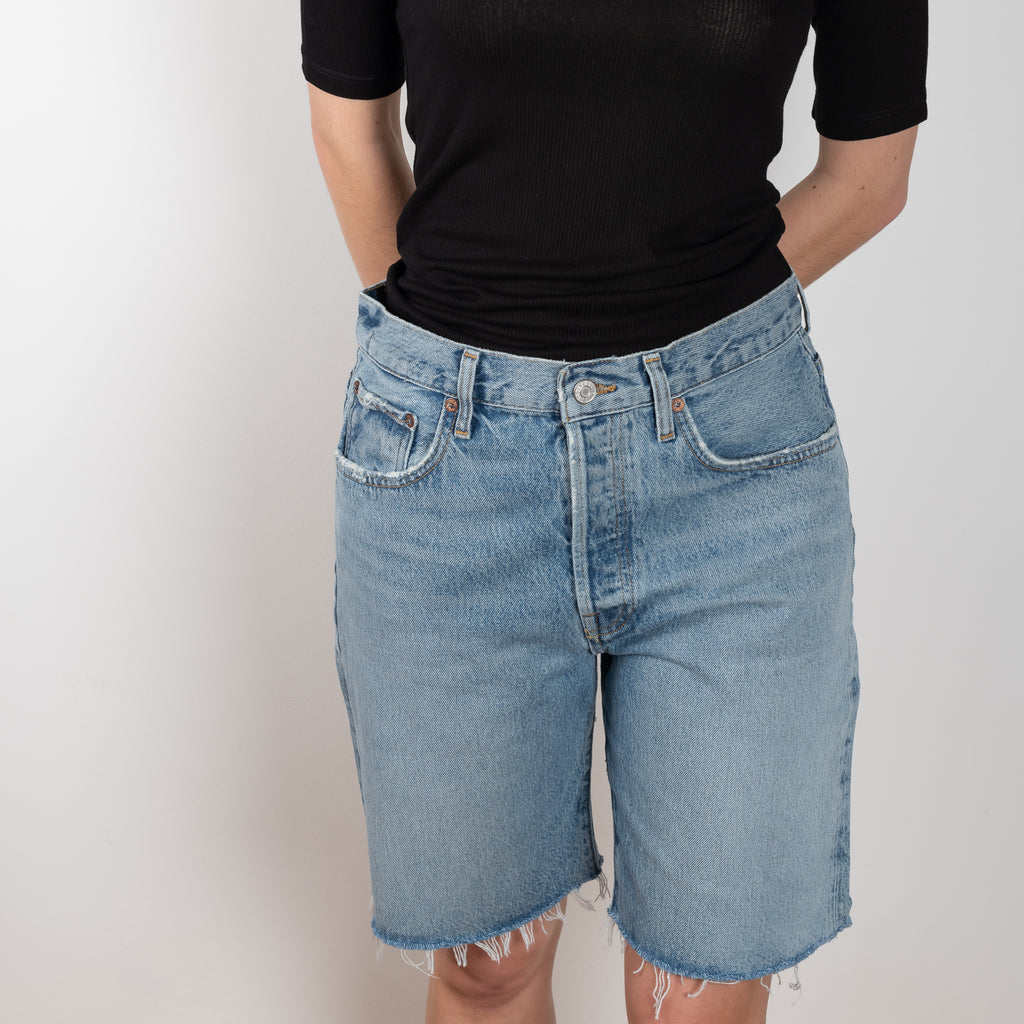 The Ira Short Waist by Agolde in color Misunderstood has a a mid-rise loose fit, longer inseam and 90's connotations in a medium blue wash