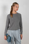 The Mila sweater by Alexandra Golovanoff is a signature round neck sweater with a boxy and effortless cut