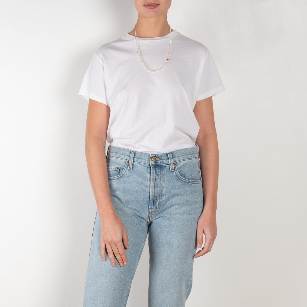 The Brit Jeans by B SIDES  is a mid waisted jeans with a full length straight leg in a mid blue wash