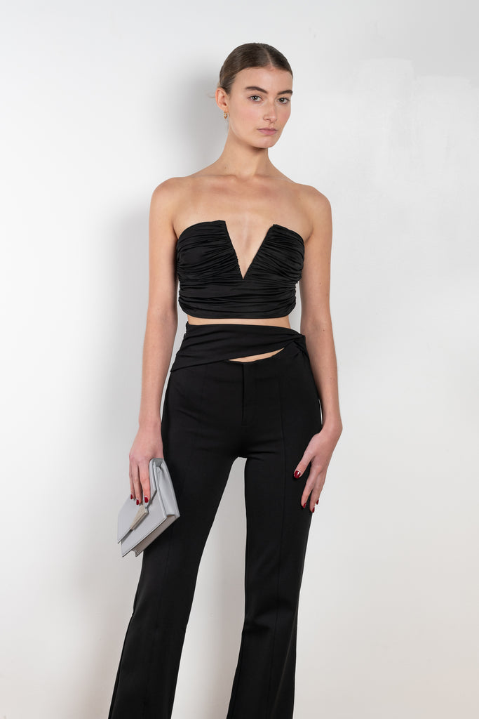 The Sesis Top by GAUGE81 is a minimal bustier top with ruching creating waves and a bold V neck