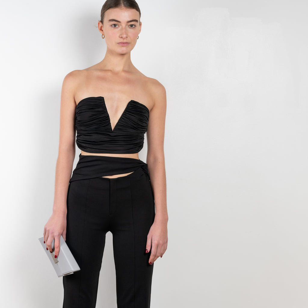 The Sesis Top by GAUGE81 is a minimal bustier top with ruching creating waves and a bold V neck