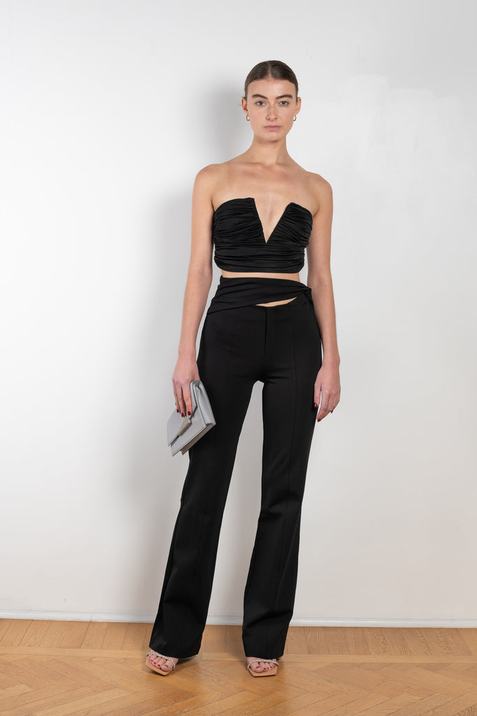 The Sesis Top by GAUGE81 is a minimal bustier top with ruching creating waves and a bold V neck