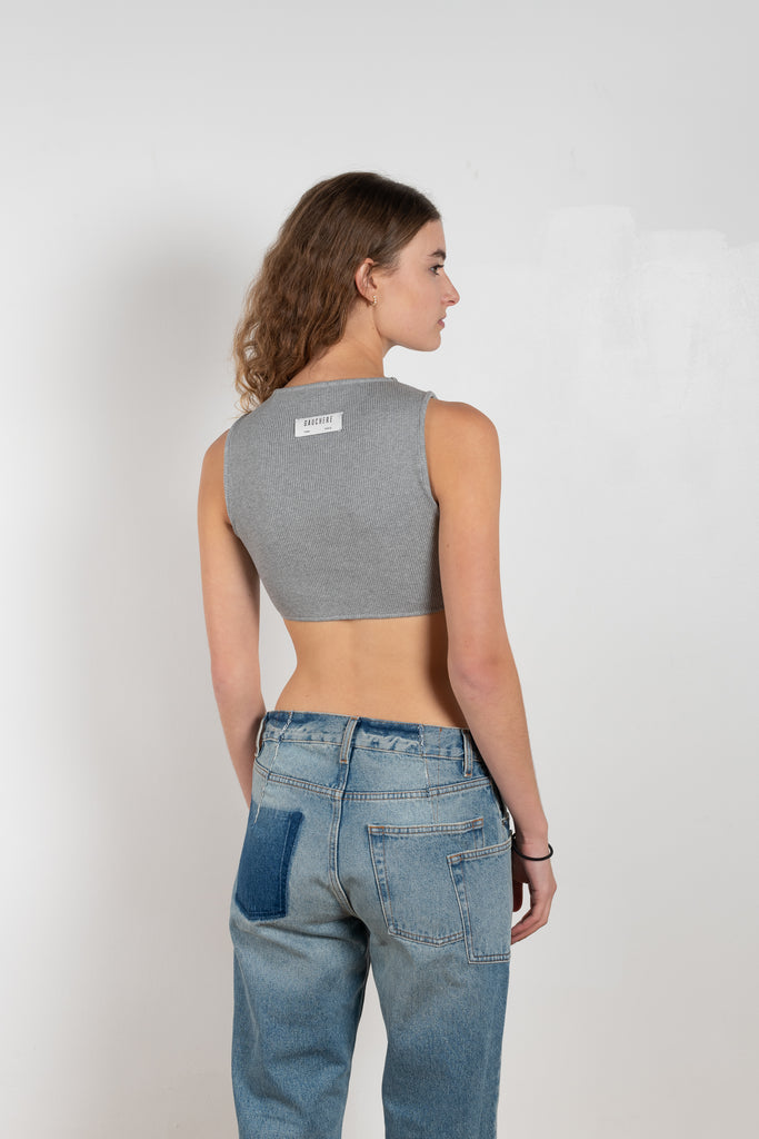 The Cropped Top by Gauchere is a fitted crop top with a high neckline and a contrasted logo label in the back