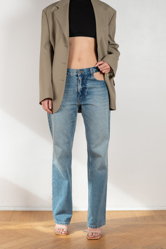 The Cut-out Jeans by Gauchere is a signature denim with a relaxed fit and a cut-out detail at the hips