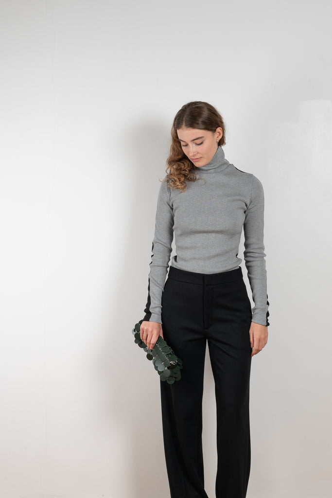 The Two Tone Top by Gauchere is a turtleneck top with a long slim fit in ribbed two tone cotton