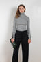 The Two Tone Top by Gauchere is a turtleneck top with a long slim fit in ribbed two tone cotton