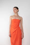The Lica Long Dress by Gauge81 is a long silk bustier dress with front slit in a vibrant orange linen
