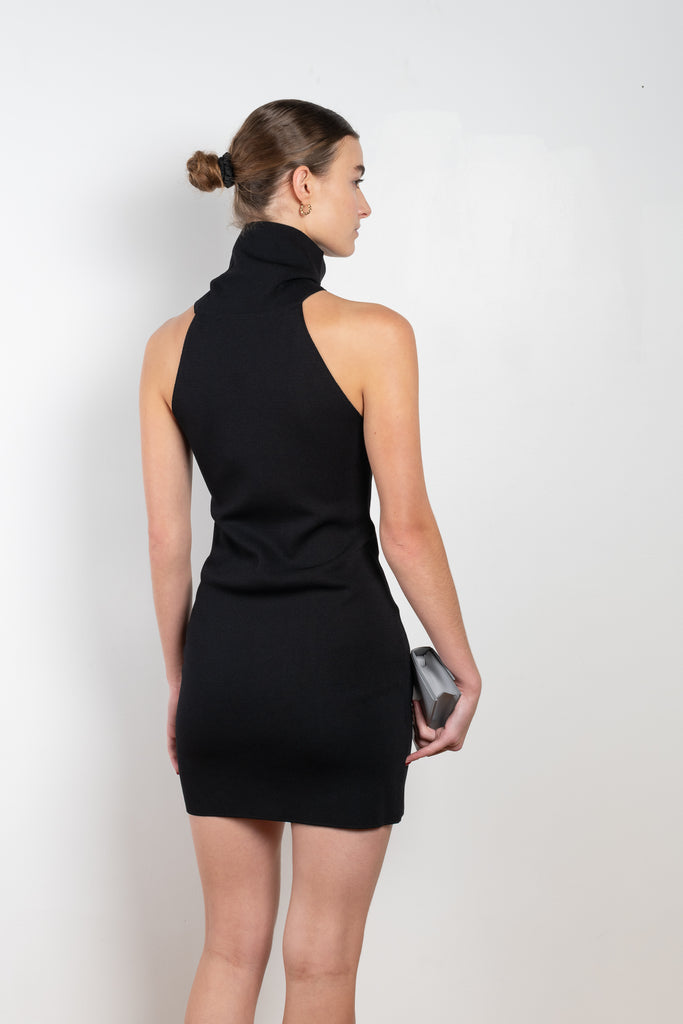 The Maioris Dress by GAUGE81 is a knitted slim cut mini dress with a halter/turtle neck and a bold front cut out