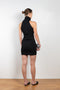 The Maioris Dress by GAUGE81 is a knitted slim cut mini dress with a halter/turtle neck and a bold front cut out