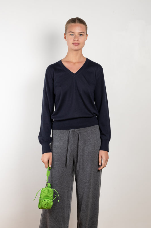 The Emilia Sweater is a fine knit cashmere sweater with a feminine v-neck