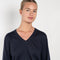 The Emilia Sweater is a fine knit cashmere sweater with a feminine v-neck