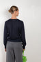 The Emilia Sweater is a fine knit cashmere sweater with a feminine v-neck