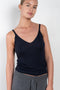 The Cleo Camisole by Lisa Yang is a fine knitted top with a ribbed structure, a deep V-neck and fine straps for a refined look